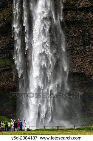 tourists in front of Seljalandsfoss, Iceland. View Large Photo Image Stock Photo - tourists in front of Seljalandsfoss, Iceland.. Fotosearch