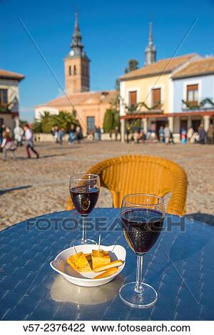 Two glasses of red wine with tapa of Spanish omelette in a terrace. Navalcarnero, Madrid province, Spain. View Large Photo Image Stock Image - Two glasses of red wine with tapa of Spanish omelette in a terrace. Navalcarnero, Madrid province, Spain.. Fotosearch