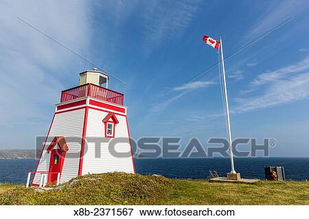 Unmanned lighthouse at Fox Point, St. Anthony, Newfoundland, Canada. View Large Photo Image Stock Photo - Unmanned lighthouse at Fox Point, St. Anthony, Newfoundland, Canada.. Fotosearch