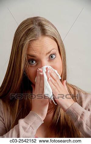 Using a handkerchief, a young adult woman blows her nose in Laguna Beach, CA. Note Cardigan sweater. View Large Photo Image Stock Image - Using a handkerchief, a young adult woman blows her nose in Laguna Beach, CA. Note Cardigan sweater.. Fotosearch