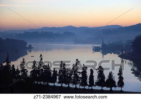 Vietnam, Dalat, Xuan Huong Lake, sunrise. View Large Photo Image Stock Photo - Vietnam, Dalat, Xuan Huong Lake, sunrise.. Fotosearch