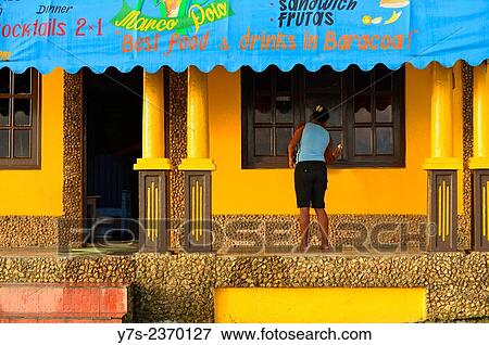 Woman cleaning window's shop in Baracoa, Cuba. View Large Photo Image Stock Photo - Woman cleaning window's shop in Baracoa, Cuba.. Fotosearch