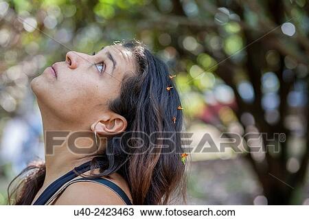 Stock Image - Woman looking at sky.. Fotosearch