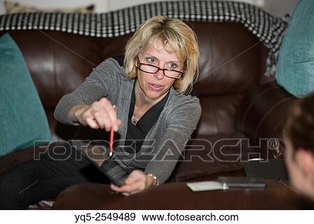 Stock Photo - woman showing something on a digital tablet.. Fotosearch
