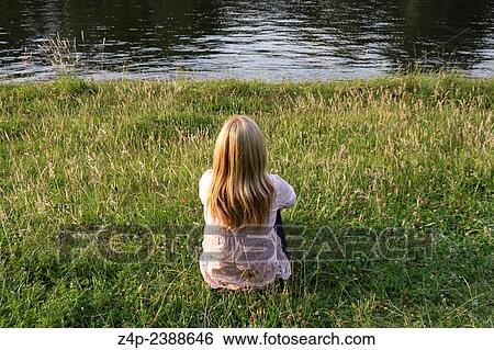woman sitting near a river spree in berlin germany View Large Photo Image Stock Photograph - woman sitting near a river spree in berlin germany. Fotosearch
