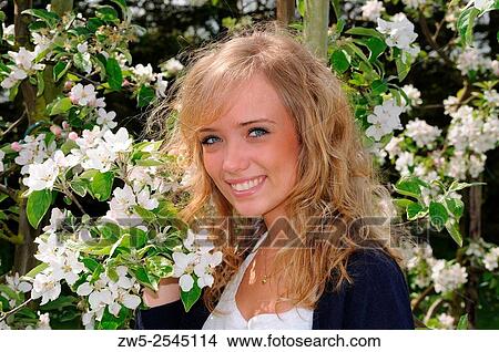 Woman with apple flowers in Kivik, Scania, Sweden. View Large Photo Image Picture - Woman with apple flowers in Kivik, Scania, Sweden.. Fotosearch