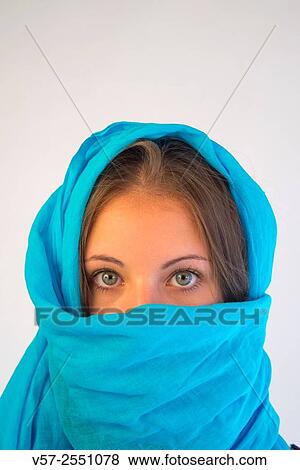 Young blonde woman wearing turquoise shawl, looking at the camera. Close view. View Large Photo Image Stock Photo - Young blonde woman wearing turquoise shawl, looking at the camera. Close view.. Fotosearch