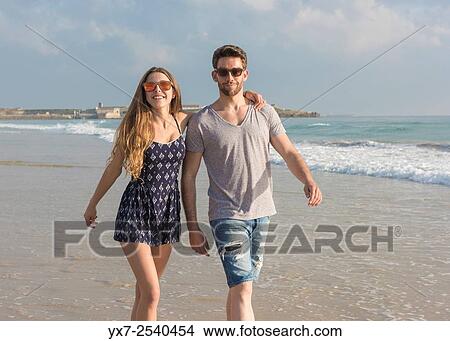 Young couple outdoors. View Large Photo Image Picture - Young couple outdoors.. Fotosearch
