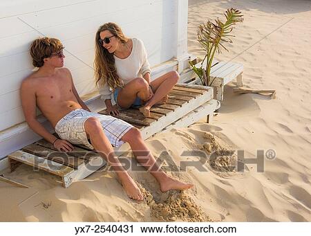 Young couple outdoors. View Large Photo Image Stock Image - Young couple outdoors.. Fotosearch