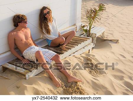 Young couple outdoors. View Large Photo Image Stock Image - Young couple outdoors.. Fotosearch