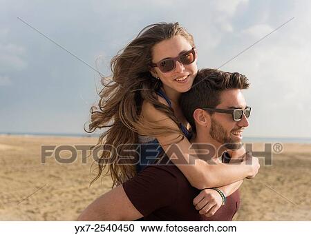 Stock Image - Young couple outdoors.. Fotosearch