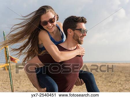 Stock Image - Young couple outdoors.. Fotosearch