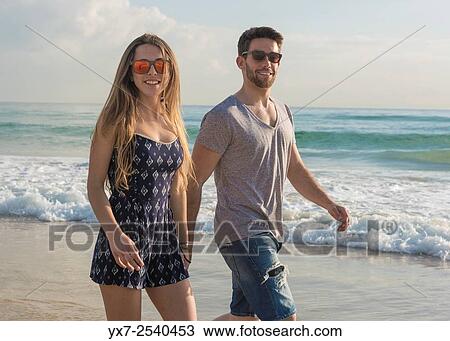 Stock Image - Young couple outdoors.. Fotosearch