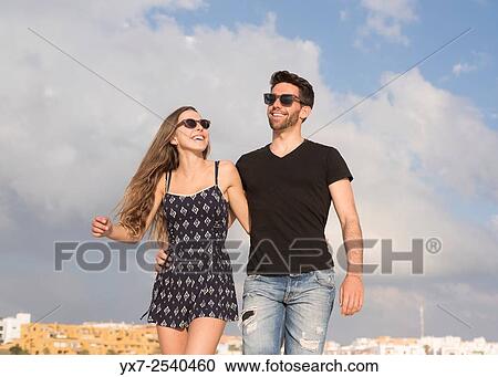 Stock Image - Young couple outdoors.. Fotosearch