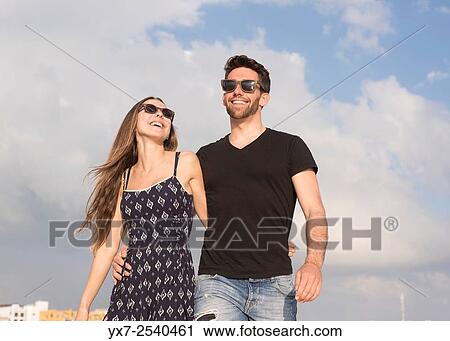 Stock Image - Young couple outdoors.. Fotosearch