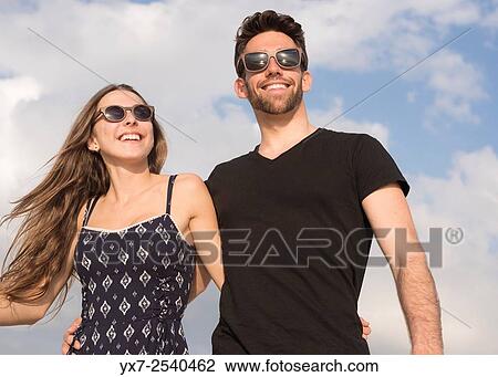 Young couple outdoors. View Large Photo Image Stock Image - Young couple outdoors.. Fotosearch