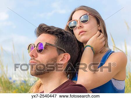 Young couple outdoors. View Large Photo Image Stock Photo - Young couple outdoors.. Fotosearch