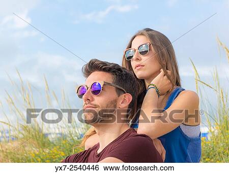 Stock Photograph - Young couple outdoors.. Fotosearch