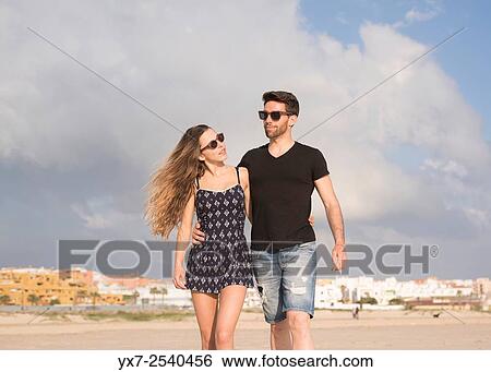 Stock Photograph - Young couple outdoors.. Fotosearch
