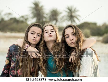 Young girls hugging on the beach, Valencia, Spain View Large Photo Image Stock Photo - Young girls hugging on the beach, Valencia, Spain. Fotosearch