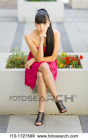 Young woman in a Red dress View Large Photo Image Stock Photo - Young woman in a Red dress. Fotosearch