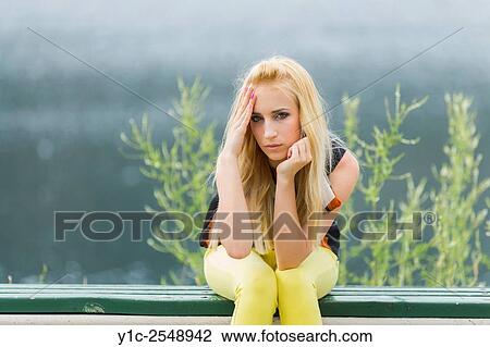 Stock Image - Young woman indifferent look.. Fotosearch