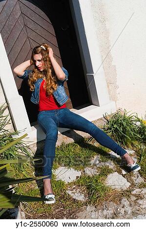 Young woman sitting spreading legs on entrance View Large Photo Image Stock Image - Young woman sitting spreading legs on entrance. Fotosearch