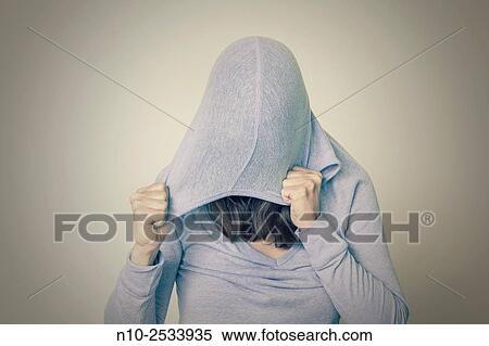 Young woman wearing a hood. View Large Photo Image Stock Photography - Young woman wearing a hood.. Fotosearch