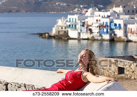 Stock Photo - 30 year old woman, Mykonos, Cyclades islands, Greece. Fotosearch