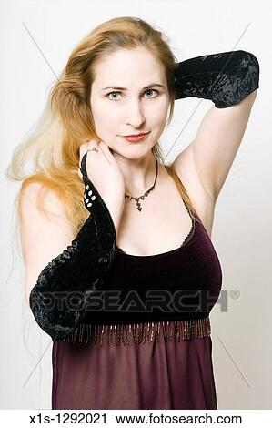 A 1/2 length image of a lady with long blond hair and fair skin who wears black gloves and looks at the viewer. View Large Photo Image Stock Image - A 1/2 length image of a lady with long blond hair and fair skin who wears black gloves and looks at the viewer.. Fotosearch