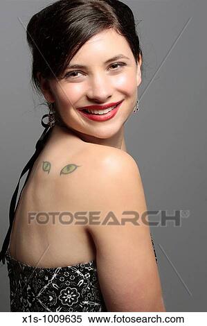 A 20-something attactive female in a sleeveless dress with a red ribbon in her hair and expressive hand gestures View Large Photo Image Stock Photography - A 20-something attactive female in a sleeveless dress with a red ribbon in her hair and expressive hand gestures. Fotosearch