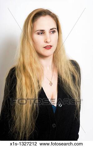 Stock Image - A fair skinned woman with very long blond hair. Fotosearch