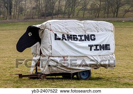Stock Image - A Sign In A Field Advertising The Seven Sisters Sheep Centre, East Dean, Sussex, UK.. Fotosearch