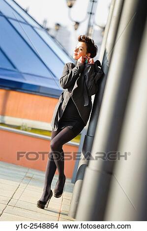 Adjusting ear-ring spontaneous teenager girl. View Large Photo Image Picture - Adjusting ear-ring spontaneous teenager girl.. Fotosearch