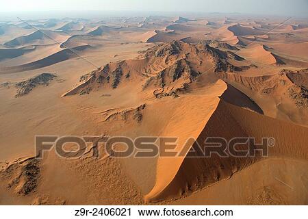 Stock Image - Aerial view of the dunes of the Namib Naukluft, the oldest desert in the world. Namibia.. Fotosearch