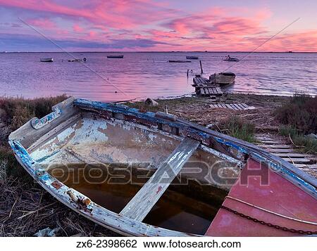 Stock Image - Alfacs Bay with small fishing boats after a great storm. Ebro River Delta Natural Park, Tarragona province, Catalonia, Spain.. Fotosearch