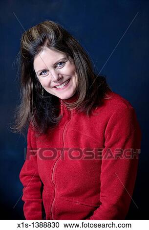 An attractive woman in jeans and a blue shirt View Large Photo Image Stock Image - An attractive woman in jeans and a blue shirt. Fotosearch