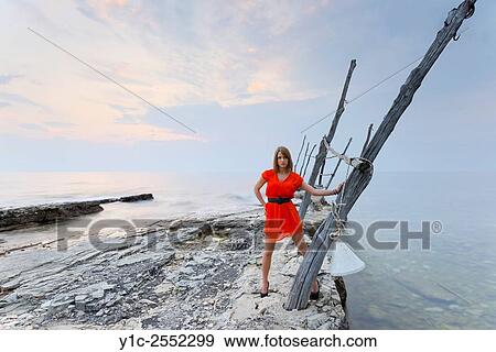 Beautiful teen girl in Red dress in Savudria Croatia View Large Photo Image Stock Photo - Beautiful teen girl in Red dress in Savudria Croatia. Fotosearch