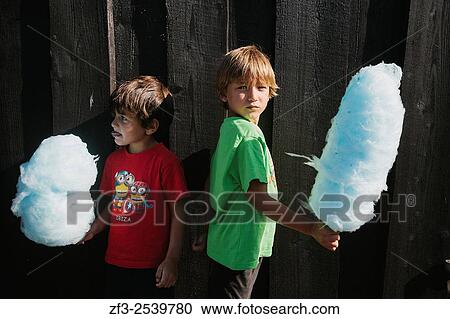 Boys eating cotton candy in Legoland, Billund. Denmark. View Large Photo Image Stock Image - Boys eating cotton candy in Legoland, Billund. Denmark.. Fotosearch