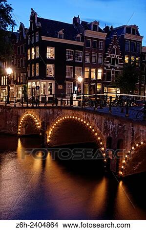 Canal at dusk in Amsterdam, Holland. View Large Photo Image Picture - Canal at dusk in Amsterdam, Holland.. Fotosearch