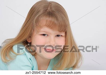 Child portrait of a blond haired girl with bangs in green shirt cropped horizontally. View Large Photo Image Stock Image - Child portrait of a blond haired girl with bangs in green shirt cropped horizontally.. Fotosearch