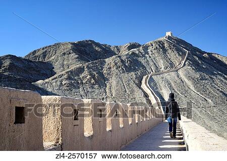 China, Gansu Province, west end of the Great Wall of China, Overhanging Great Wall near Jiayuguan, Model Released. View Large Photo Image Stock Photo - China, Gansu Province, west end of the Great Wall of China, Overhanging Great Wall near Jiayuguan, Model Released.. Fotosearch