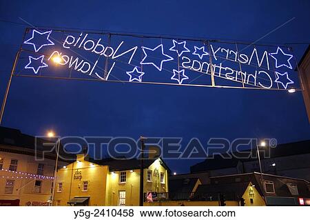 Christmas street lights at night in Caernarfon wales great britain uk View Large Photo Image Stock Photo - Christmas street lights at night in Caernarfon wales great britain uk . Fotosearch
