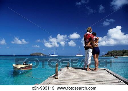 couple on a pontoon in Mayreau, Grenadines islands, Saint Vincent and the Grenadines, Winward Islands, Lesser Antilles, Caribbean Sea View Large Photo Image Stock Image - couple on a pontoon in Mayreau, Grenadines islands, Saint Vincent and the Grenadines, Winward Islands, Lesser Antilles, Caribbean Sea. Fotosearch