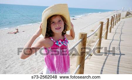 Cute Girl pulling her hat Down View Large Photo Image Stock Photo - Cute Girl pulling her hat Down. Fotosearch