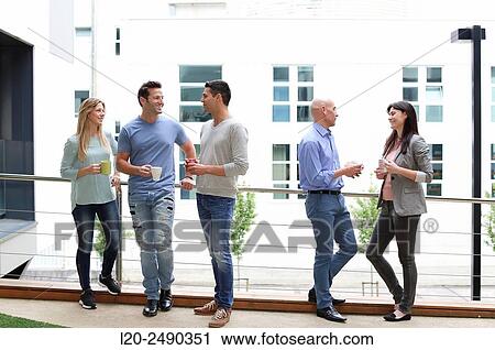 Stock Image - Executives drinking coffee. Break.. Fotosearch