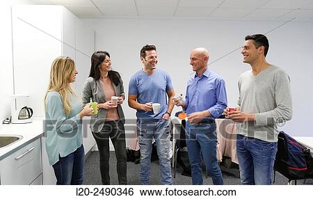 Stock Photograph - Executives drinking coffee. Break.. Fotosearch