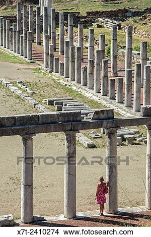 Exploring amongst the doric stoas that surround the stadium, at Ancient Messene, Messinia, Peloponnese, Greece. View Large Photo Image Picture - Exploring amongst the doric stoas that surround the stadium, at Ancient Messene, Messinia, Peloponnese, Greece.. Fotosearch