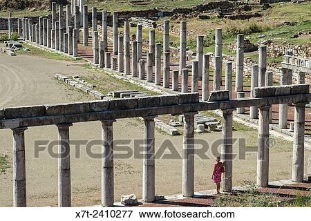 Stock Photo - Exploring amongst the doric stoas that surround the stadium, at Ancient Messene, Messinia, Peloponnese, Greece.. Fotosearch