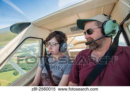 Father and daughter flying light plane over the eastern shore of Maryland, USA. View Large Photo Image Stock Photography - Father and daughter flying light plane over the eastern shore of Maryland, USA.. Fotosearch